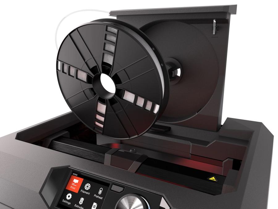 A large disc on the top of the printer holds white filament.