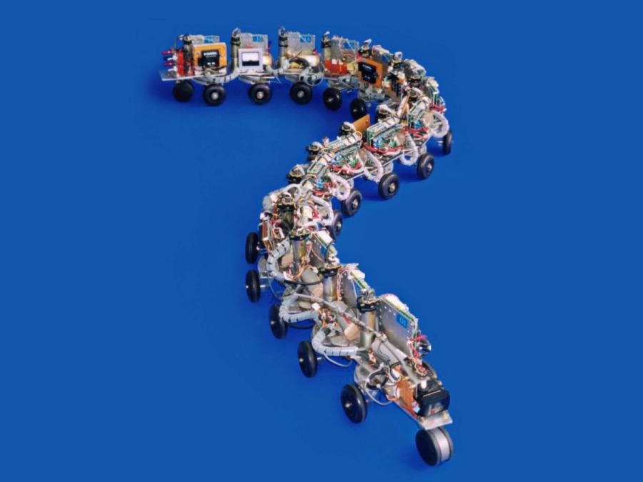 A segmented wheeled robot on a blue background.