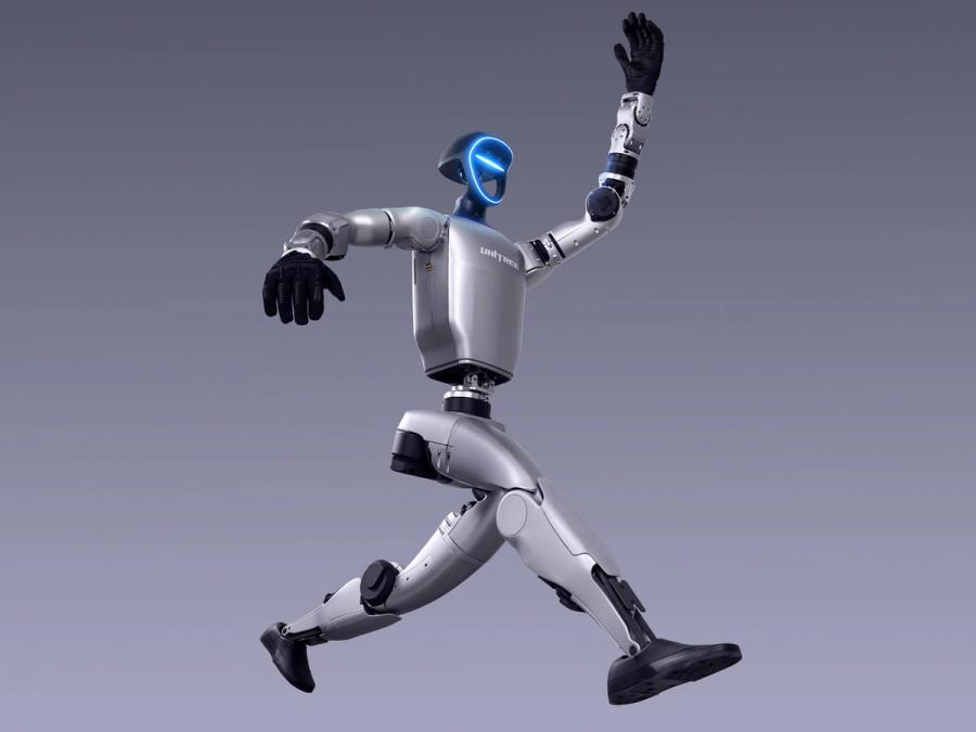 Unitree Robotics' G1 silver and black bipedal humanoid robot jumps in the air.