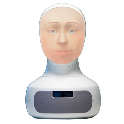 A tabletop Furhat robot has a silver-white base with a unique, back projected face.