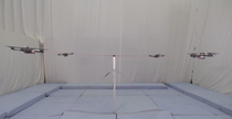 Quadcopters Tied to a Pole Do Cooperative Acrobatics